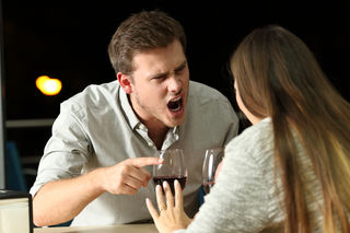 abusive man shouting on a woman